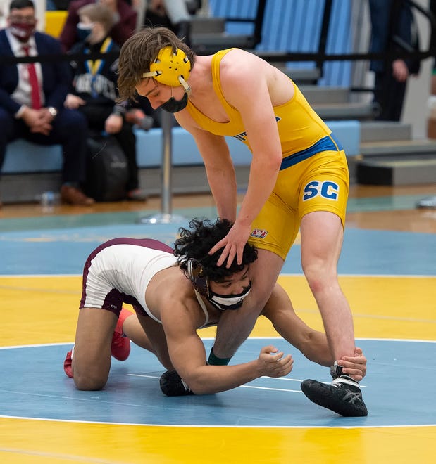 Caravel's Ethan Gray and Sussex Central's Mason Ankrom (top) wrestle in the 138 pound championship match at the DIAA State Individual Wrestling Championship at Cape Henlopen High School Wednesday, March 3, 2021.