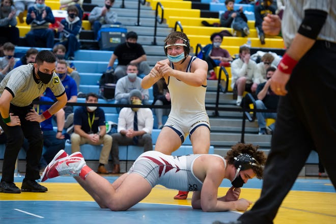 SanfordÕs Justin Griffith (top) defeats CaravelÕs Matthew Duarte in the 170 pound championship match at the DIAA State Individual Wrestling Championship at Cape Henlopen High School Wednesday, March 3, 2021.