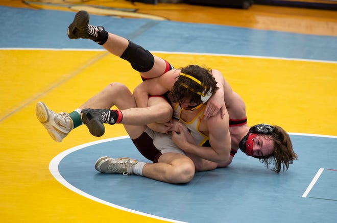 William PennÕs Danny Sinclair (rear) and MilfordÕs Trent Grant wrestle in the 132 pound championship match at the DIAA State Individual Wrestling Championship at Cape Henlopen High School Wednesday, March 3, 2021.