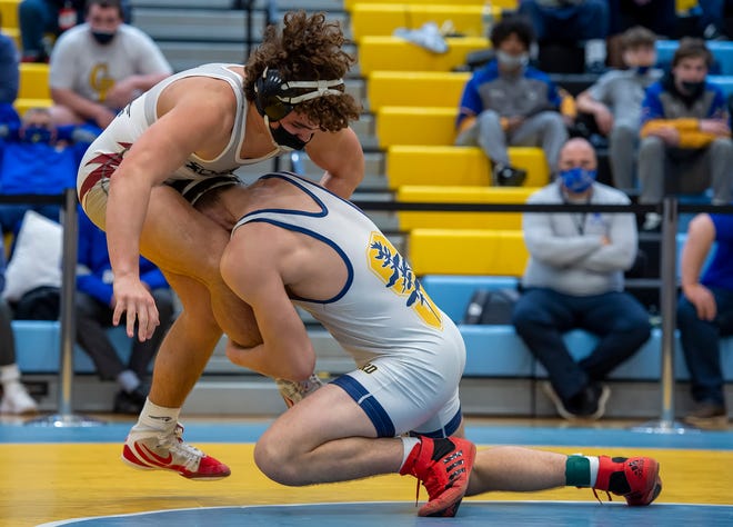 Sanford's Justin Griffith (right) and Caravel's Matthew Duarte wrestle in the 170 pound championship match at the DIAA State Individual Wrestling Championship at Cape Henlopen High School Wednesday, March 3, 2021.